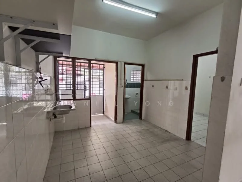 Room features: white tiled walls, grey tiled flooring, single-bowl stainless-steel sink, window with metal grille, doorway leading to bathroom, doorway leading to another room, fluorescent ceiling light, wall-mounted hooks; style: minimalist.