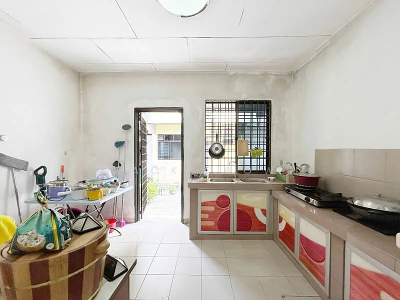 Kitchen features: white painted walls, tile flooring, kitchen cabinets with colorful design, stainless-steel sink, single-bowl stainless-steel sink, built-in stove, window with security bars, door leading to outdoor area, countertop with space for appliances, open layout to adjacent area; view: garden.