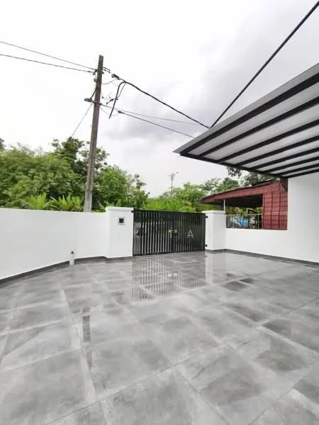 Exterior features: grey polished tile flooring, white painted walls, metal gate, landscaped greenery, overhead roof with beams, paved driveway, electricity poles visible; style: modern.