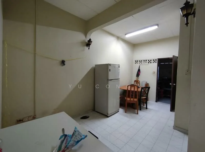 Kitchen features: white walls, tile flooring, refrigerator, wood dining table, four wooden chairs, light fixture on ceiling, doorway to adjacent room, wall-mounted light fixtures, cabinets above the countertop.