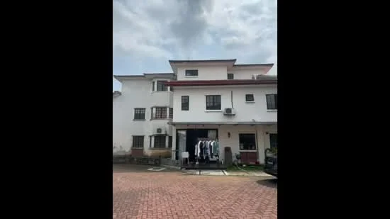 Exterior type: semi-detached house; features: white painted facade, flat roof, 2-storey structure, brick driveway, visible air conditioning units, clothes drying rack, front porch area, parking space, manicured lawn, windows with black frames; style: modern.