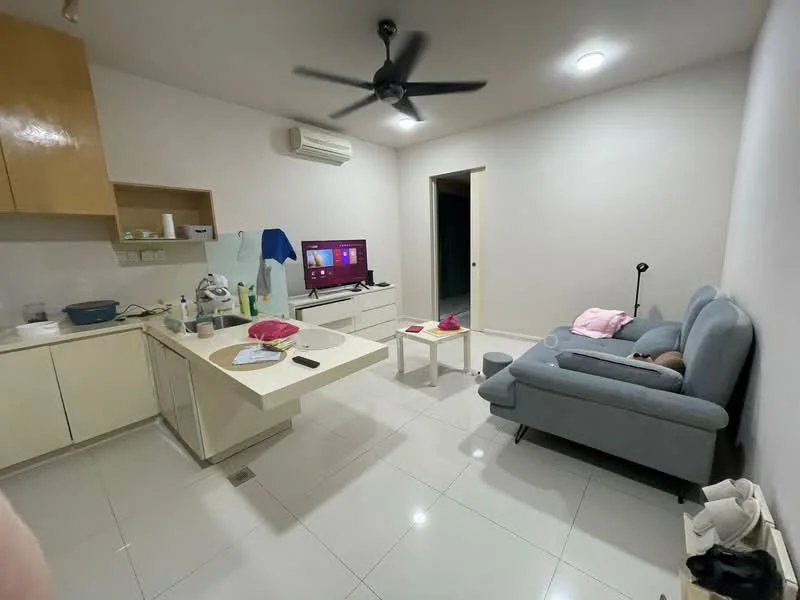 Living features: grey fabric sofa, coffee table, wall-mounted TV, TV console, ceiling fan, wall-mounted air conditioning unit, white painted walls, glossy tile flooring, kitchenette with beige cabinetry, countertop with sink, refrigerator, decorative items on countertop; style: modern.