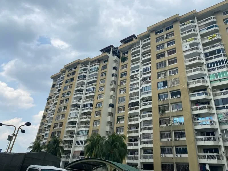 Exterior type: mid-rise condominium; features: cream painted facade, balconies with glass railings, multiple storeys, visible air conditioning units, palm trees in foreground, cloudy sky, parking area in front; style: modern.