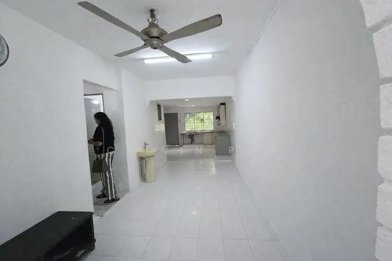 Room features: white painted walls, ceramic tile flooring, 5-blade ceiling fan, window with view to outside, doorway leading to kitchen, doorway leading to bathroom, light fixture on ceiling, open layout; style: modern; view: garden.