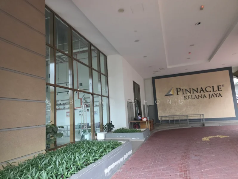 Exterior type: high-rise condominium; features: glass curtain wall, cream painted facade, manicured landscaping, paved walkway, entrance with signage, covered entrance area; style: modern.