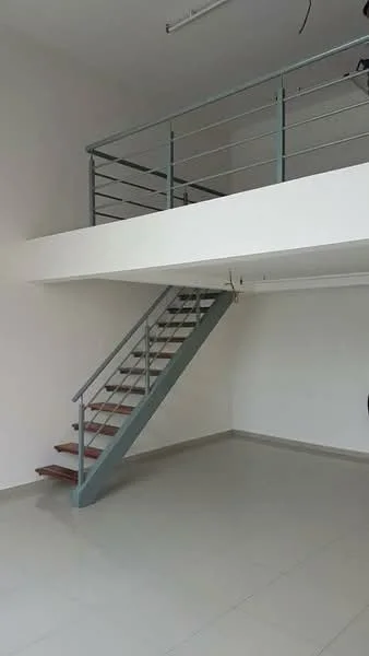 Room features: white painted walls, grey metal railing, staircase with wooden steps, tile flooring, high ceiling, open space layout, ceiling lights, no visible furniture; style: modern.