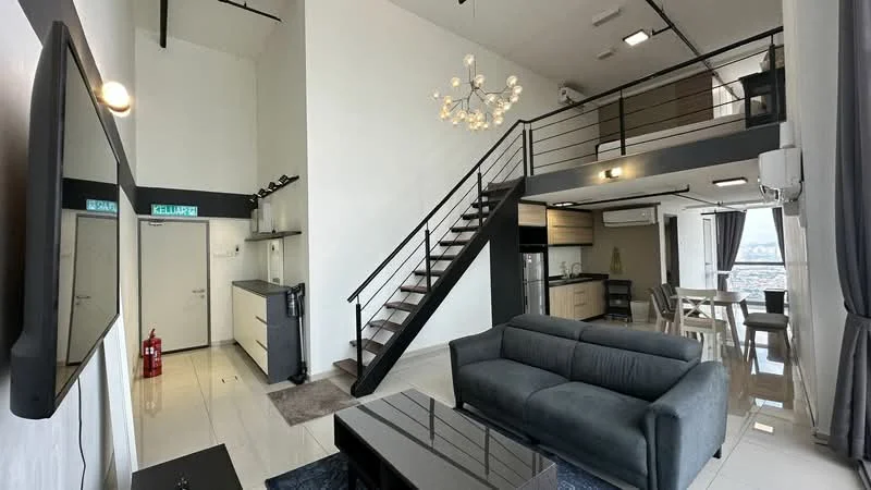 Living features: grey fabric sofa, black coffee table, wall-mounted TV, chandelier with multiple bulbs, white painted walls, high ceiling, large windows with city view, recessed downlights, wooden staircase leading to loft area, air conditioning unit, curtains, open-plan layout; style: modern; view: city. Kitchen features: kitchen island, built-in cabinets, stainless-steel appliances, black countertop, open shelving, refrigerator, oven, sink, bar stools; style: modern.