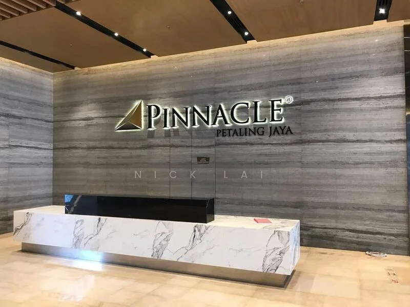Exterior type: main entrance gate; features: marble reception counter, grey stone wall cladding, illuminated logo signage, wooden ceiling panels, recessed lighting, polished tile flooring; style: modern.