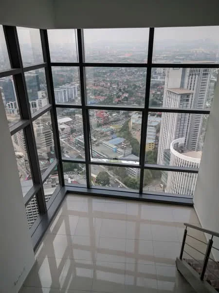 Room features: floor-to-ceiling windows, city view, glossy tiled flooring, white painted walls, open space, natural light, modern design, staircase visible; style: modern; view: city.