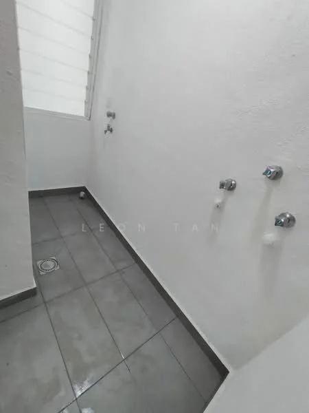 Room features: white painted walls, grey tile flooring, floor drain, two water supply outlets, natural light from window.