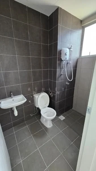 Bathroom features: grey tiled walls, grey tiled flooring, one-piece toilet, wall-mounted shower head, handheld shower, shower mixer, small wall-mounted sink, window for natural light; style: modern.