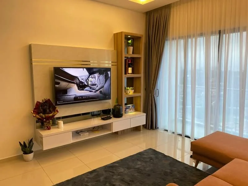 Living features: wall-mounted TV, white media console, wooden shelving unit, large floor-to-ceiling windows, sheer curtains, grey area rug, brown sectional sofa, decorative houseplant, decorative items on shelves, recessed ceiling lights; style: modern; view: city.