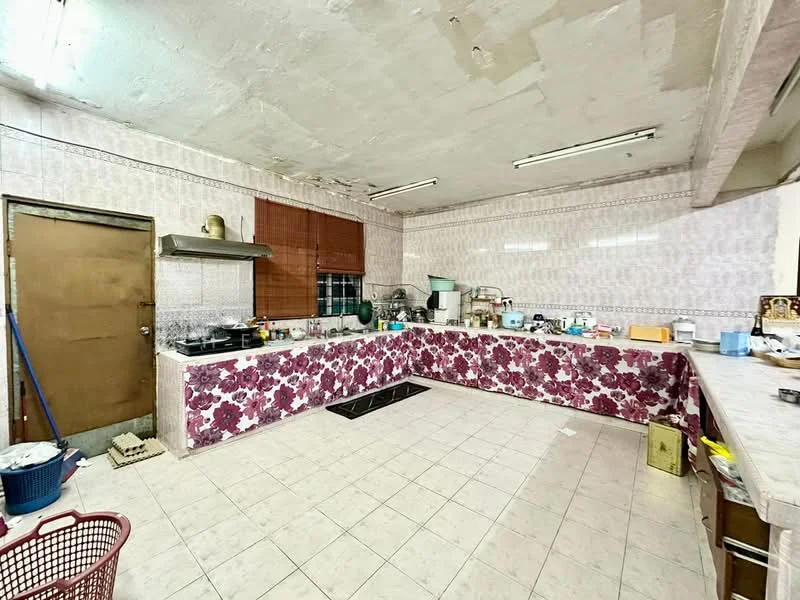 Kitchen features: white tiled flooring, pink floral wallpaper, grey ceiling, stainless-steel range hood, built-in kitchen cabinets, double-basin sink, gas stove, countertop with storage, window with blinds, various kitchen appliances, open layout, large kitchen space; style: traditional.