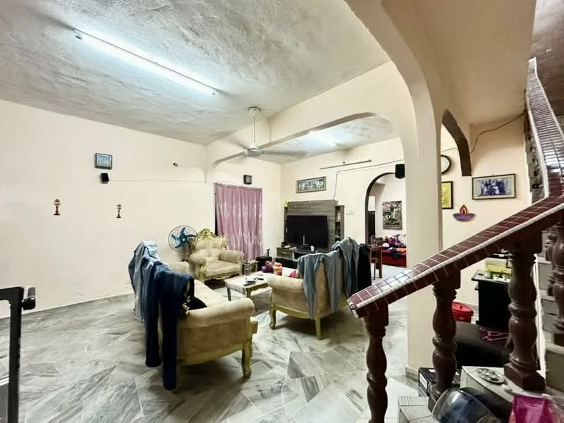 Living features: light grey painted walls, marble tile flooring, ceiling fan, sofa set in beige, coffee table, TV console, wall-mounted TV, decorative wall art, curtains, staircase with wooden railing.