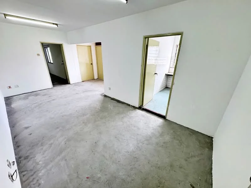 Room features: white painted walls, concrete flooring, single door, two doorways, fluorescent ceiling lights.