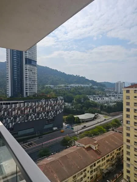 Exterior type: high-rise condominium; features: glass curtain wall, mixed material facade, surrounded by greenery, urban context with nearby buildings, view of hills in background, road visible in foreground; style: modern.