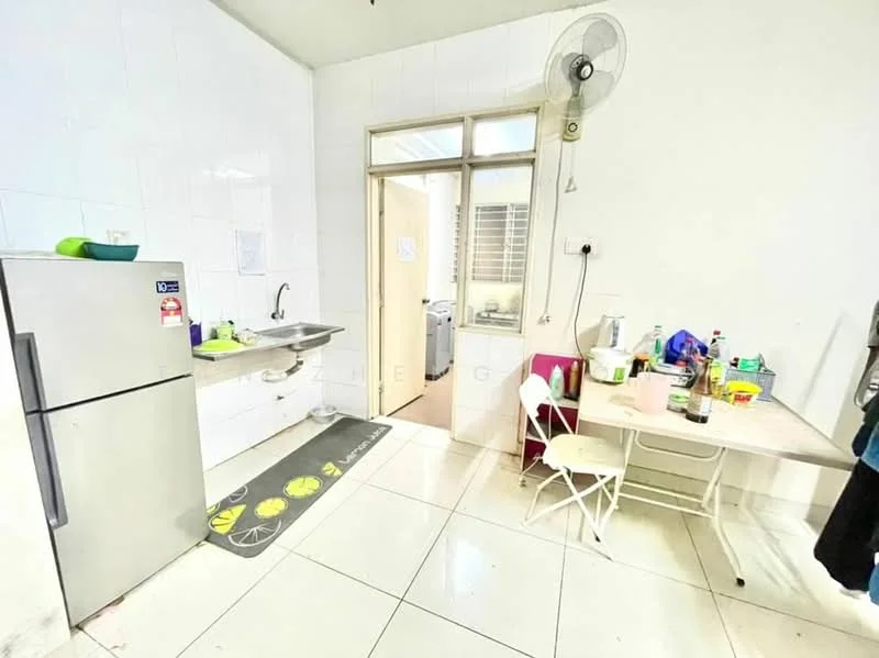 Kitchen features: stainless-steel fridge, single-bowl stainless-steel sink, chrome pull-down faucet, white tiled walls, white tiled flooring, window with blinds, table with chairs, kitchen mat with fruit design, various kitchen utensils and containers.