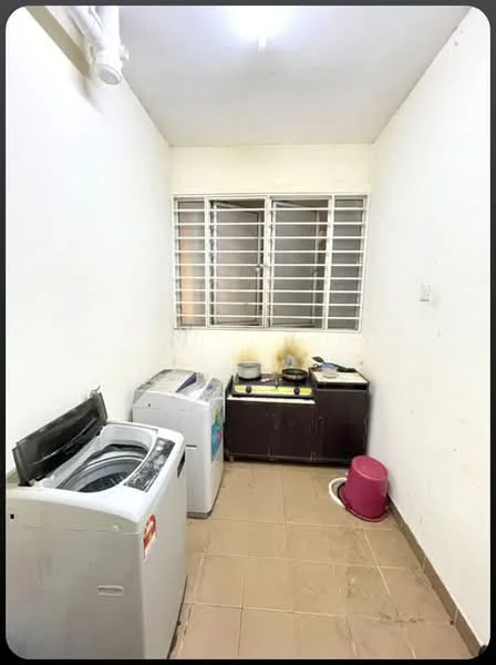 Laundry features: top-load washing machine, front-load washing machine, window with metal grille, tile flooring, white painted walls, wooden cabinet, stove, pink plastic basin.