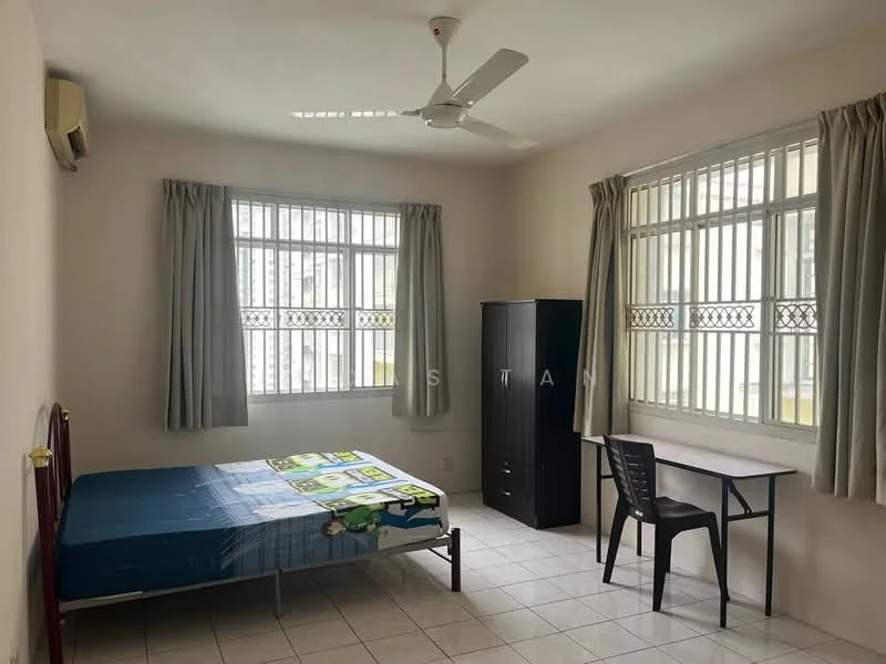 Bedroom features: single bed, bed frame with red finish, mattress with blue cover, ceiling fan, 2 windows with grilles, curtains in light grey, study desk, black chair, wardrobe in dark finish, white tiled flooring, air conditioning unit.