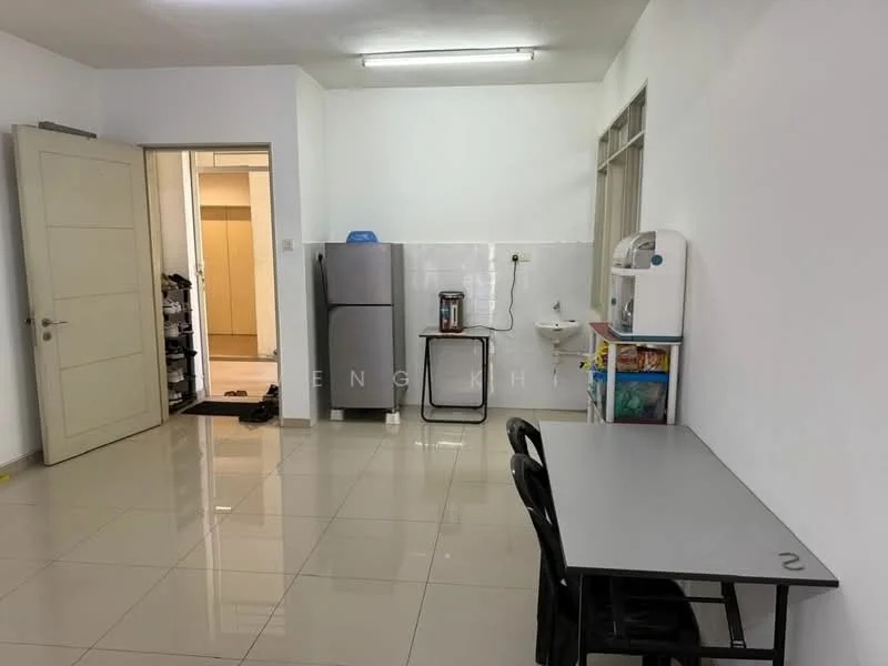 Kitchen features: grey tiled flooring, white painted walls, single-bowl stainless-steel sink, chrome pull-down faucet, stainless-steel fridge, microwave, kitchen table with grey surface, black plastic chairs, wall-mounted cabinet, countertop with storage underneath; style: modern. Room features: doorway leading to another room, light switch, white walls.