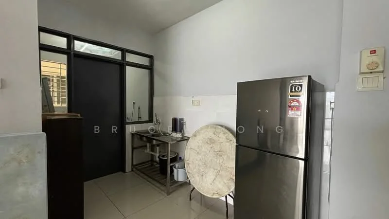 Kitchen features: white painted walls, glossy tile flooring, stainless-steel fridge, wooden table, black metal chair, kitchen countertop, sink, wall-mounted electrical panel, door leading to another room; style: modern.
