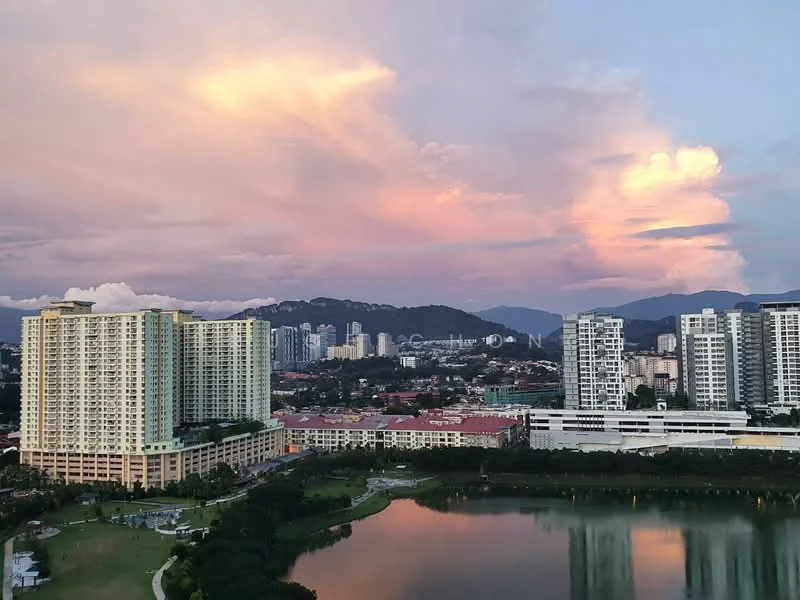 Exterior type: high-rise condominium; features: glass curtain wall, multiple balconies, surrounded by greenery, waterfront view, city skyline in background, manicured lawn, swimming pool visible, parking deck, adjacent to park, mountain view in background; style: modern.