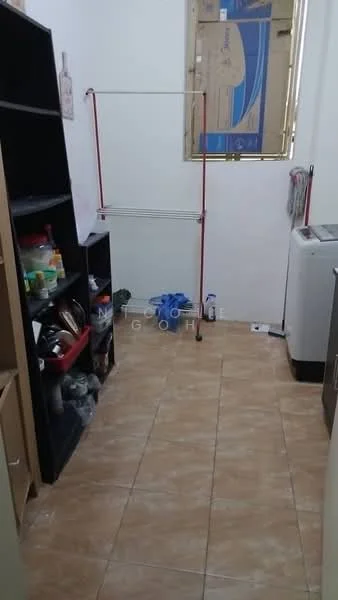 Laundry features: tile flooring, white walls, built-in shelving unit, freestanding washing machine, clothes drying rack, storage containers, cleaning supplies, open space layout.