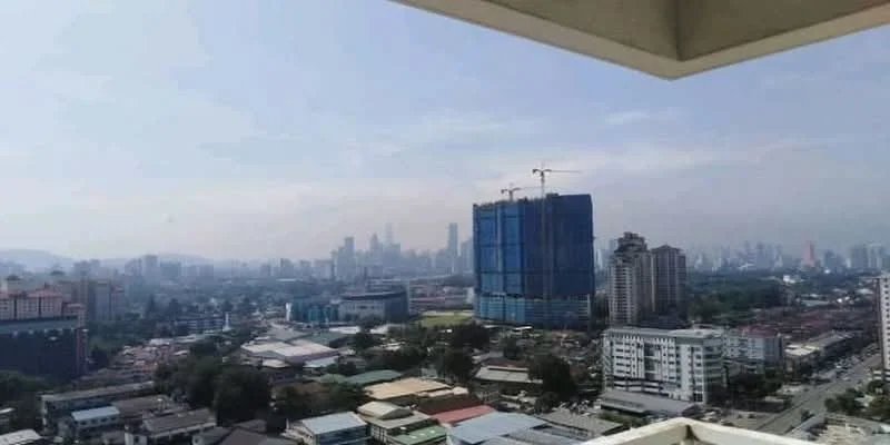Exterior type: high-rise condominium; features: city skyline view, surrounded by urban landscape, visible construction site, tall buildings in background, clear sky, mixed-use development, high-rise structures, varied building heights; style: modern.