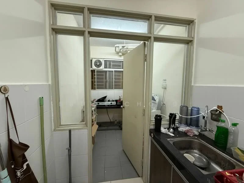 Kitchen features: single-bowl stainless-steel sink, chrome pull-down faucet, black countertop, white tiled backsplash, white painted walls, grey floor tiles, built-in gas stove, overhead cabinets, open shelving, refrigerator, microwave, kitchen utensils on countertop.
