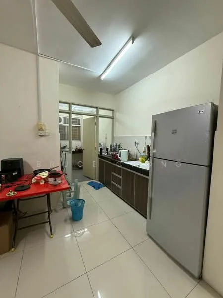 Kitchen features: white painted walls, glossy tile flooring, ceiling lights, 5-blade ceiling fan, stainless-steel fridge, built-in cabinets with wood finish, countertop with appliances, sink, microwave, kitchen utensils on table, red table with chairs, waste basket; style: modern.