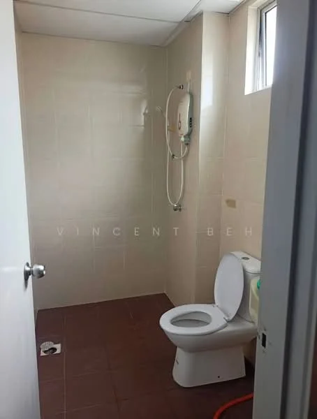 Bathroom features: white tiled walls, brown ceramic tile flooring, one-piece toilet, shower with wall-mounted showerhead, window for natural light, toilet paper holder, drain in floor, shower curtain rod.