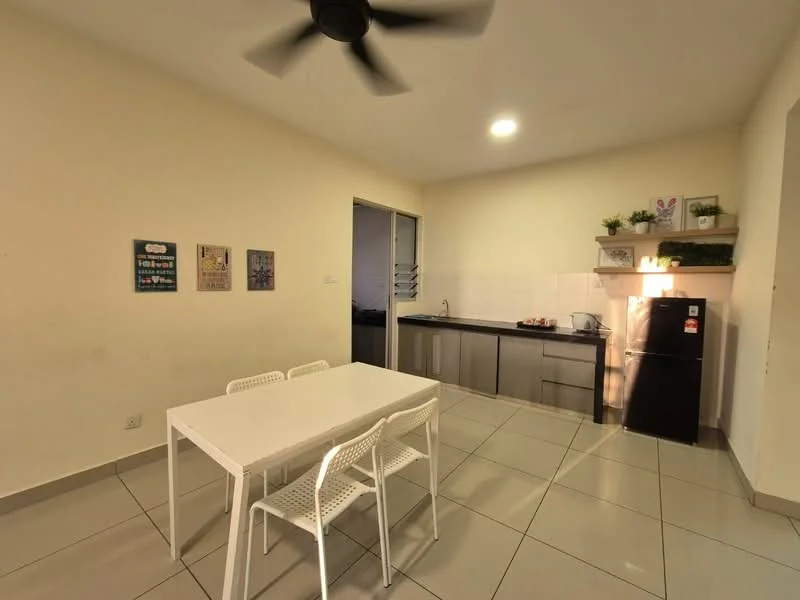 Kitchen features: white painted walls, grey tiled flooring, 5-blade ceiling fan, recessed LED downlights, stainless-steel fridge, built-in kitchen cabinets with grey finish, white countertop, kettle, microwave, decorative plants on shelf, dining table with 4 white chairs; style: modern.