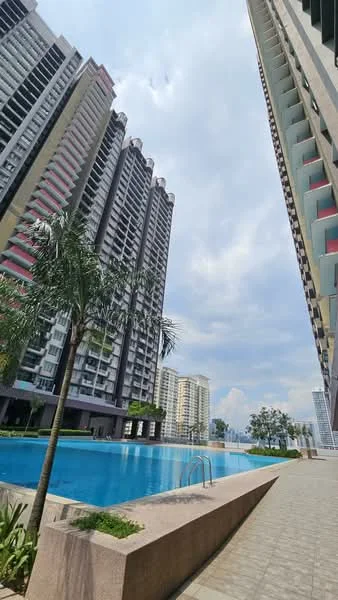Exterior type: high-rise condominium; features: infinity pool, pool deck with loungers, landscaped garden, palm trees, glass curtain wall facade, balconies on upper floors, surrounded by mature greenery, modern architectural design; style: modern.