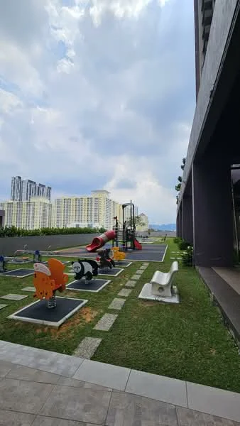Exterior features: children's playground equipment, colorful play structures, rubberized safety surface, manicured lawn, stone-paved walkway, surrounding greenery, city skyline in background, multi-storey residential buildings in background; style: modern.
