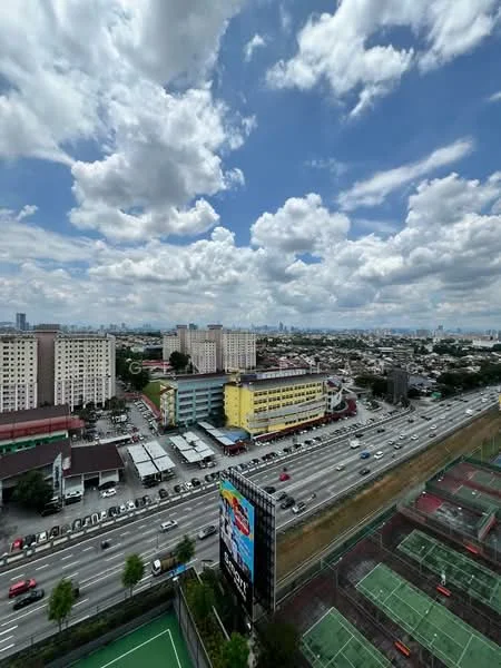 Exterior type: high-rise condominium; features: city skyline view, highway visible, tennis courts, green space, multiple residential buildings, billboard signage, cloudy sky, urban landscape; style: modern.