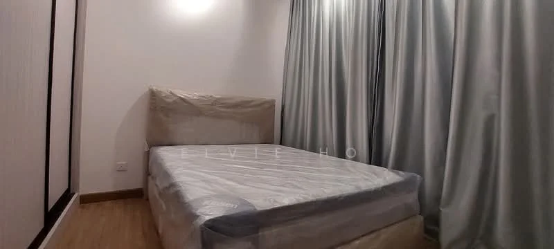 Bedroom features: queen-size bed with protective covering, light wood flooring, white painted walls, floor-to-ceiling curtains in light grey, minimalist design, no visible furniture other than bed; style: minimalist.