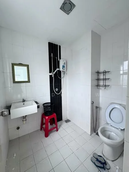 Bathroom features: white tiled walls, black accent wall, white floor tiles, single-bowl sink, chrome faucet, mirror with decorative frame, shower with handheld showerhead, toilet, towel rack, red plastic stool, shower heater, drain in floor; style: modern.