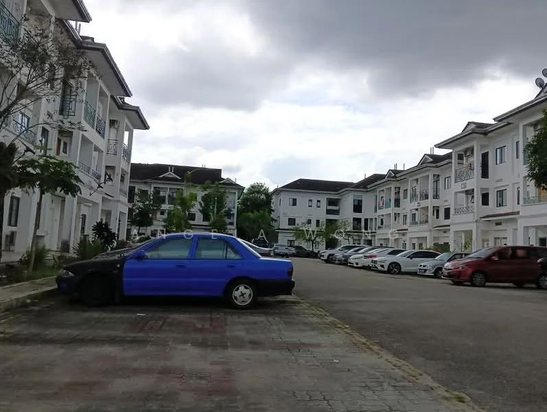 Exterior type: low-rise apartment block; features: white painted facade, balconies with railings, manicured landscaping, paved parking area, multiple parked cars, surrounded by greenery, two-storey buildings, cloudy sky; style: modern.