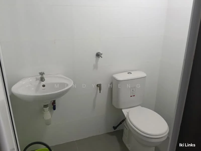 Bathroom features: white tiled walls, grey tile flooring, wall-mounted sink, chrome faucet, one-piece toilet, toilet paper holder, exposed plumbing, mirror above sink; style: modern.