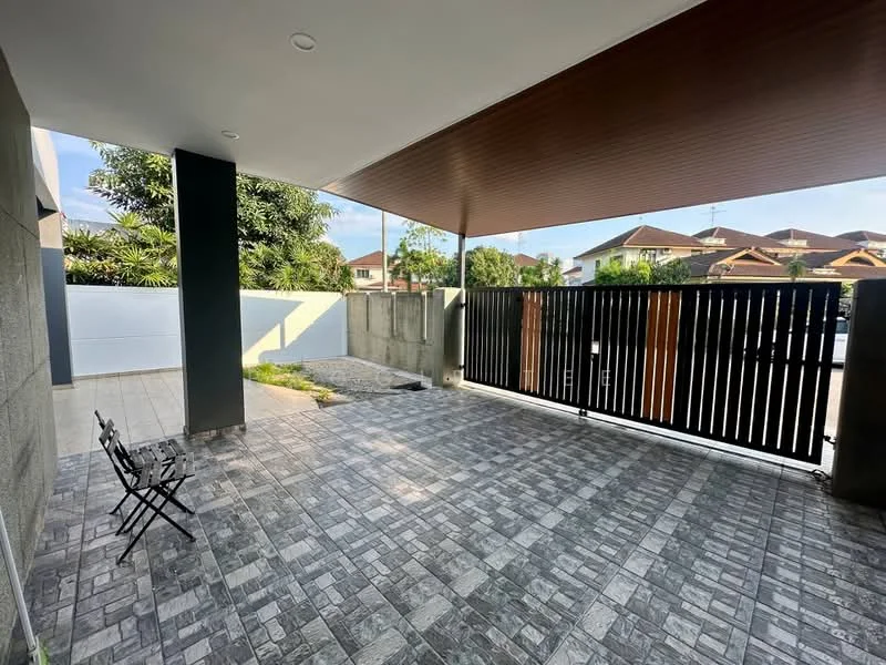 Exterior features: paved flooring, covered patio, wooden ceiling, fence with vertical slats, landscaped garden area, surrounding greenery, open space, two outdoor chairs; style: modern.