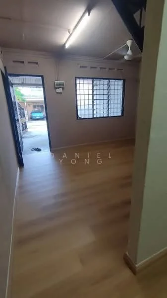 Room features: light wood laminate flooring, cream painted walls, ceiling fan, large windows with grid pattern, door leading to outdoor area, staircase visible in the background; style: modern.