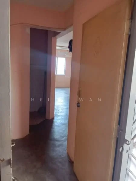 Room features: pink painted walls, concrete flooring, door leading to another room, window with natural light, corner wall, hallway, light fixture on ceiling.