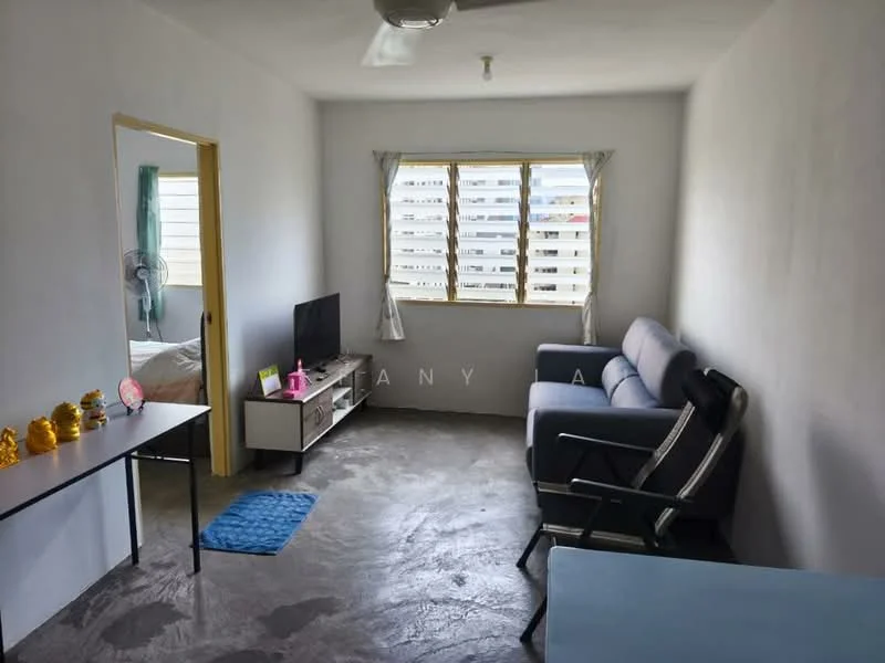 Living features: grey fabric sofa, TV console, wall-mounted TV, coffee table, ceiling fan, window with horizontal slats, light grey walls, concrete flooring, decorative items on table, blue area rug; style: minimalist. Room features: doorway leading to another room, light grey walls, window with horizontal slats.
