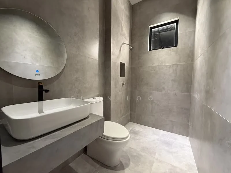 Bathroom features: grey tile walls, grey tile flooring, round mirror, white rectangular sink, black faucet, wall-mounted shower head, toilet, small window; style: modern.