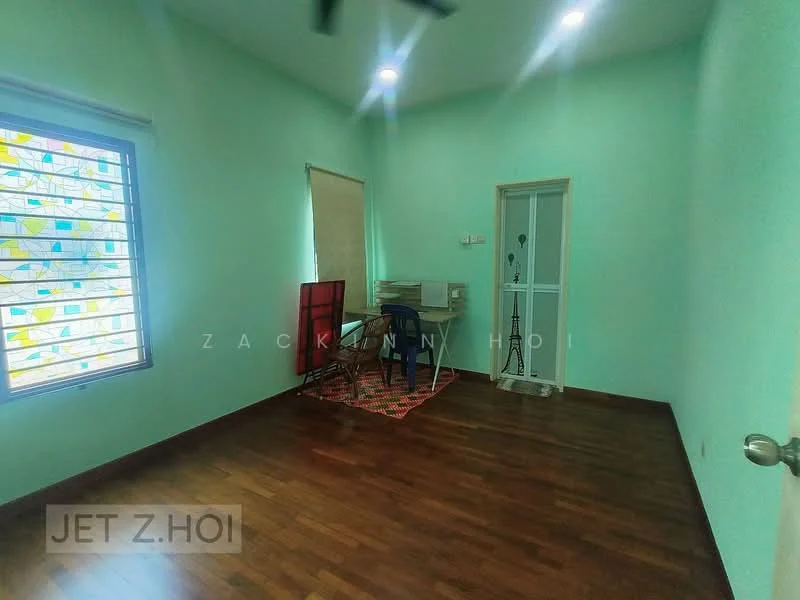 Room features: light green painted walls, dark wood flooring, ceiling fan, window with decorative glass, roller blinds, study desk, chair, small decorative lamp, door leading to another room; style: modern.