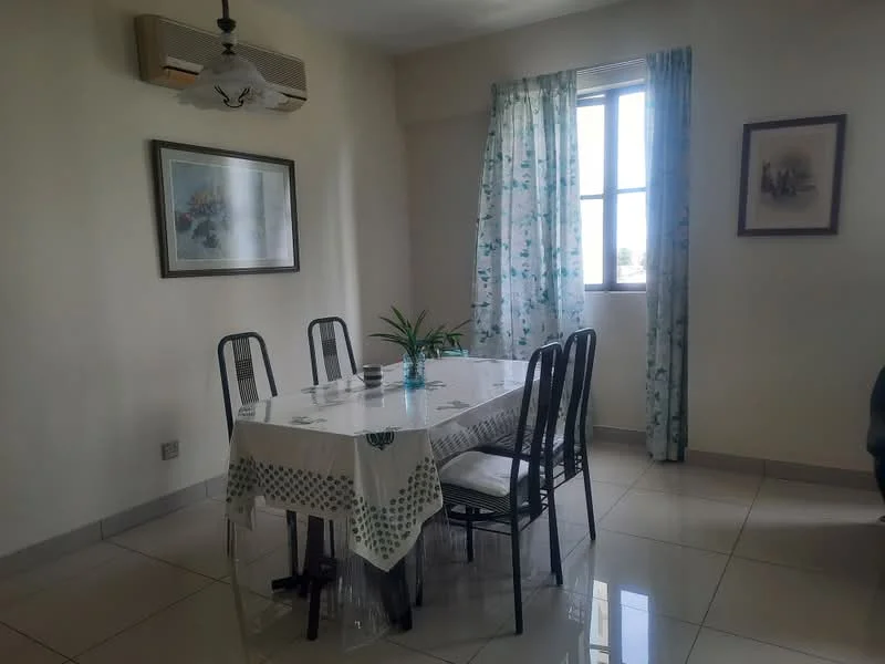 Dining features: 4-seater dining table, black metal dining chairs, white tablecloth with green pattern, pendant light fixture, floor-to-ceiling window, sheer curtains with floral pattern, cream painted walls, glossy tile flooring, air conditioning unit on wall, framed artwork on wall, indoor plant on table; style: modern; view: city.
