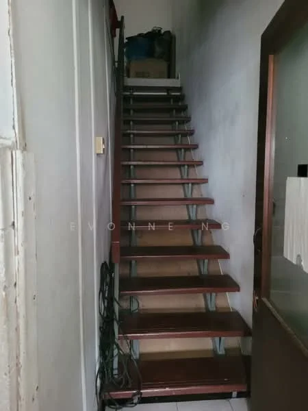 Room features: wooden staircase, metal railing, white walls, tile flooring, storage area at top of stairs, cables along the wall.