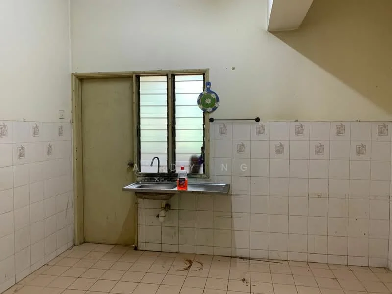 Kitchen features: single-bowl stainless-steel sink, chrome faucet, white tiled walls, cream painted walls, light-colored tiled flooring, window with horizontal slats, wall-mounted shelving, no visible appliances.