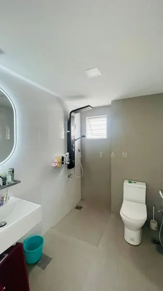 Bathroom features: white wall tiles, grey accent wall, single-sink vanity with white cabinet, chrome basin mixer faucet, framed mirror, one-piece toilet, walk-in shower with glass enclosure, rain shower head, handheld shower, tile flooring, window for natural light, towel rail; style: modern.