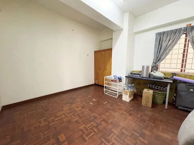 Room features: wooden flooring, white painted walls, window with sheer curtains, built-in wardrobe, storage cart, plastic storage bins, desk with items, corner space, light fixture on ceiling.